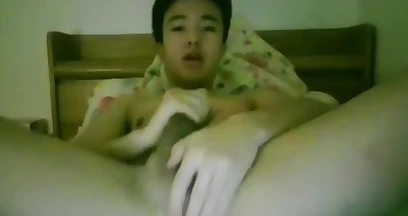 Young Chinese boy having his first cumshot on cam